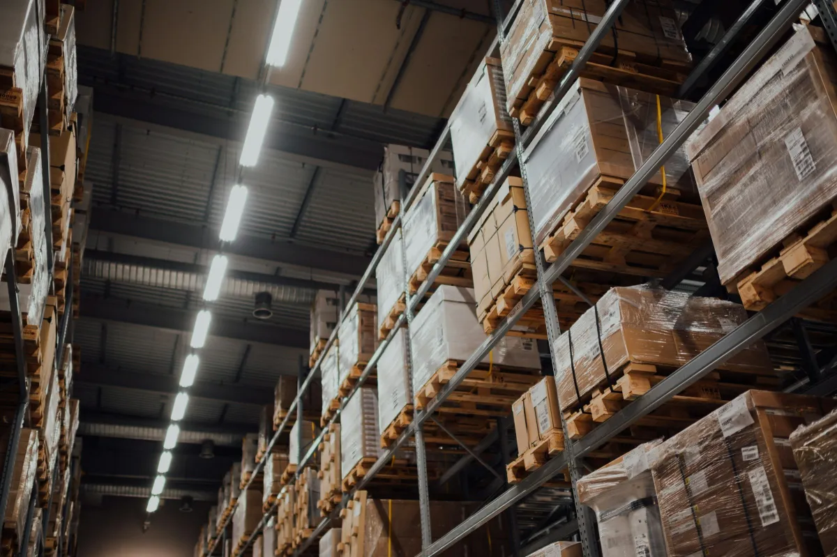 Warehouse racks stacked with boxed and palletised goods