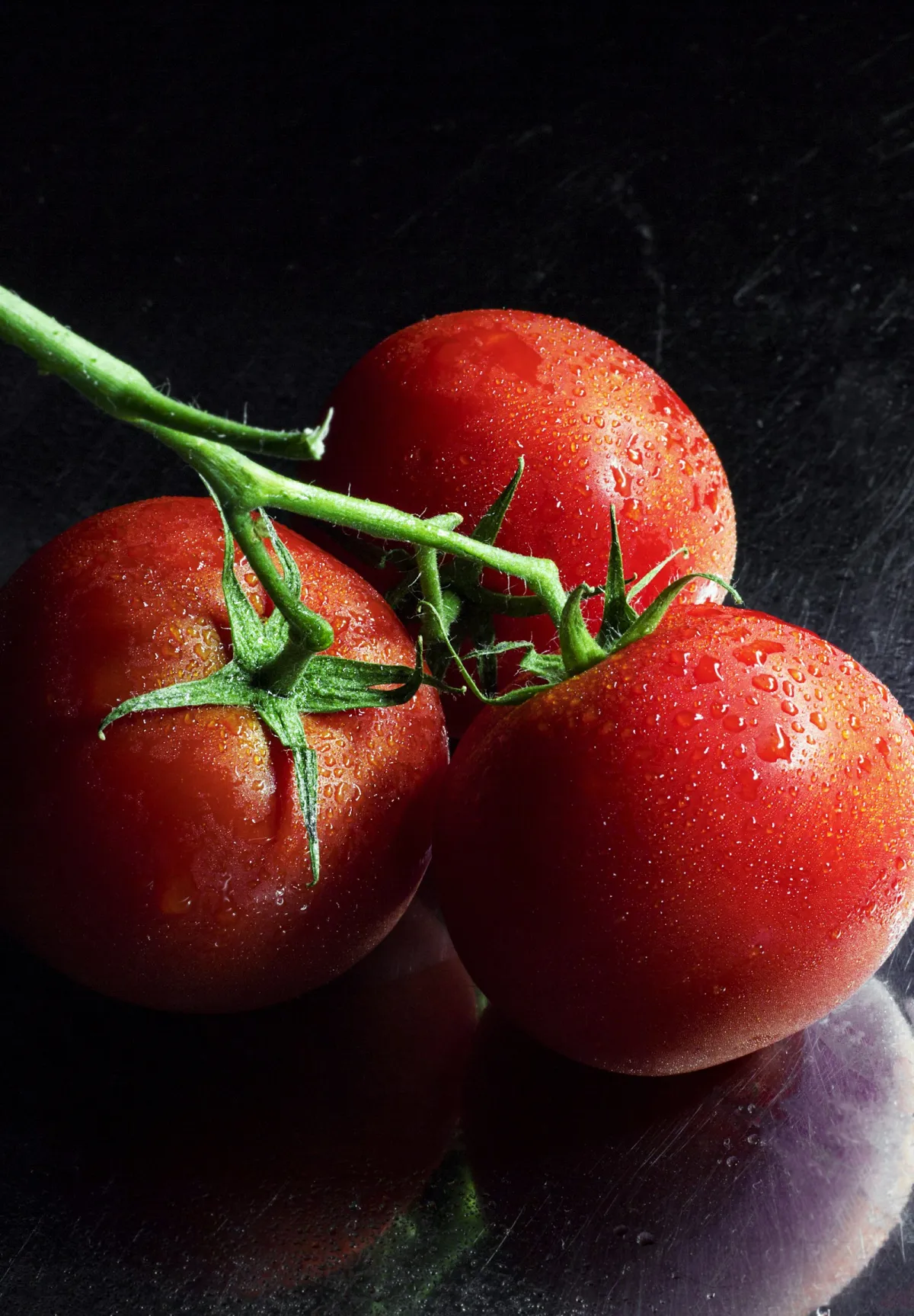 Fresh red commercial tomatoes in bulk wholesale crates for food processing and retail